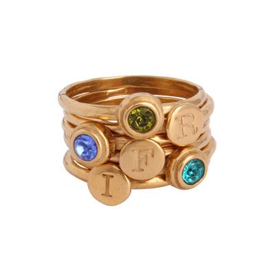 3 stone mothers ring stacked in gold