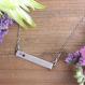 silver birthstone bar necklace on model