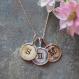stamped initial necklace with gold, rose gold and silver charms